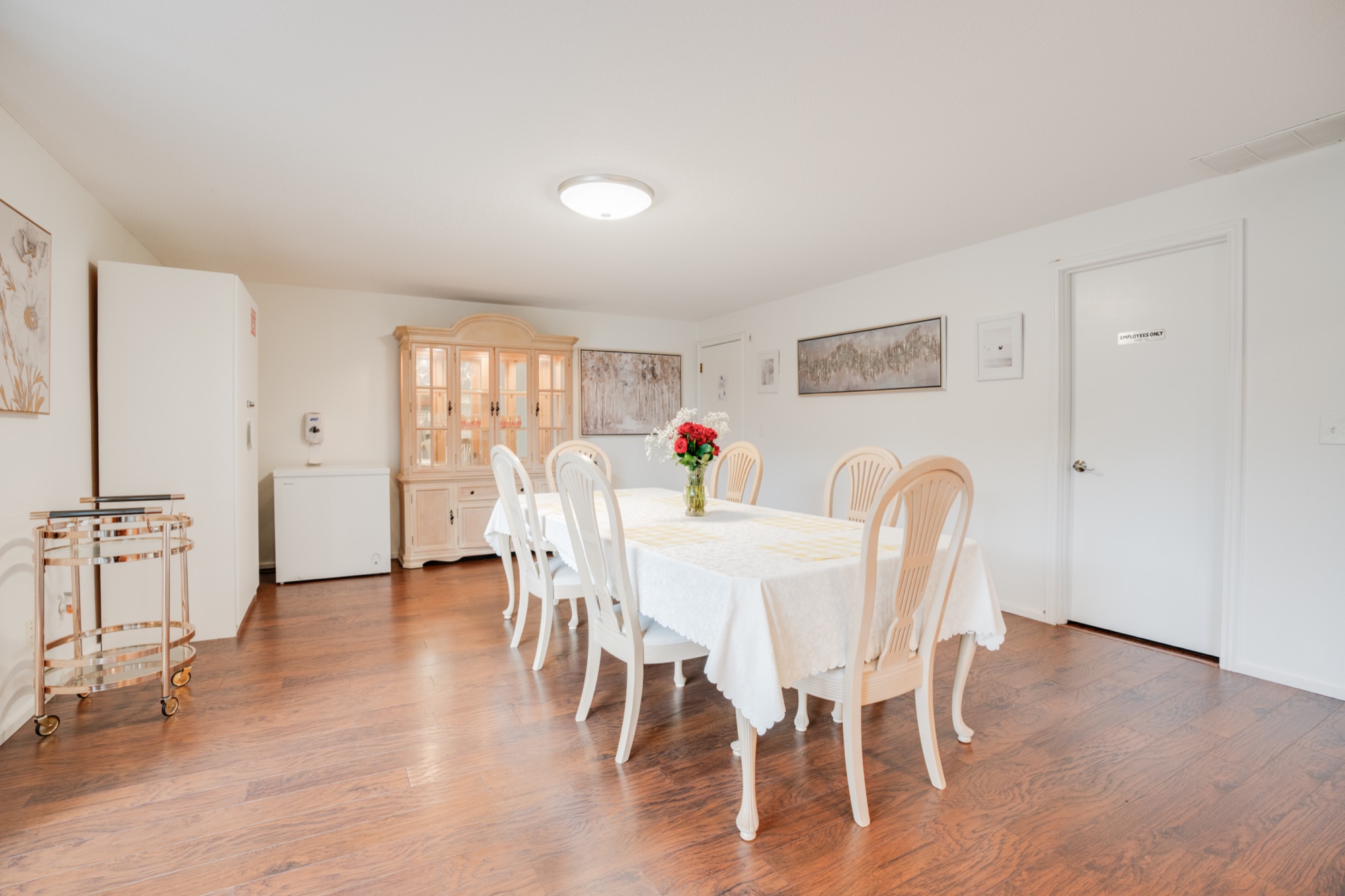Dining room with a large table set for residents