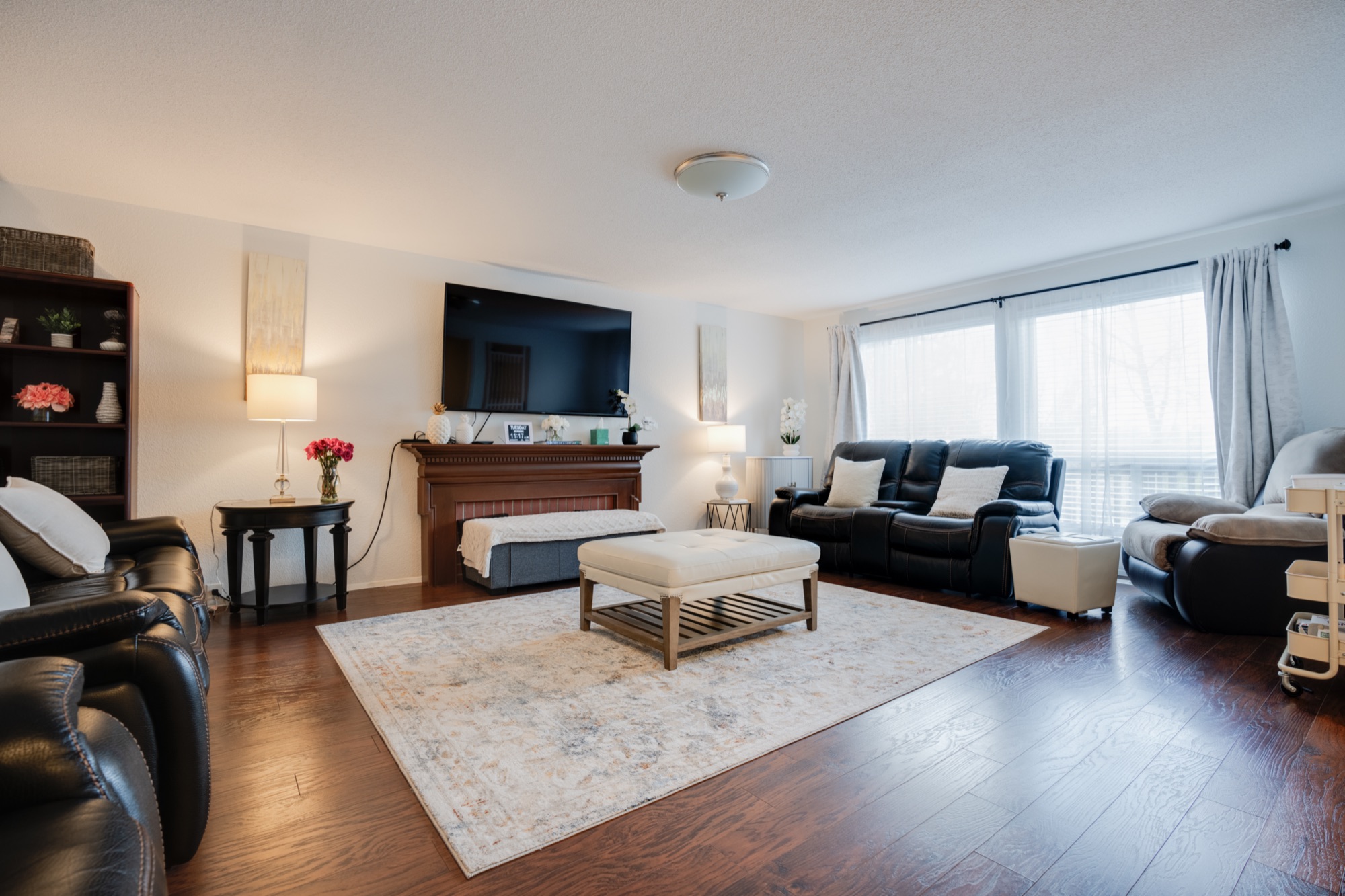 Sunlit shared living room at Tree Lane Adult Family Home